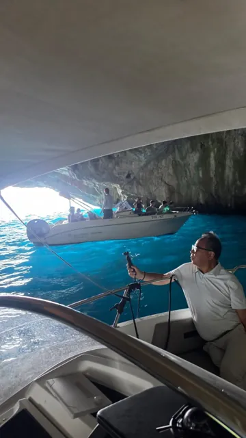 Boat and guests inside a sea cave on the Montenegro coast