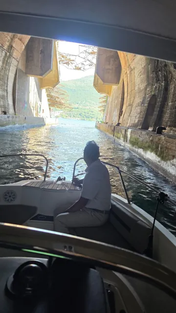 View from a boat inside a coastal tunnel in Boka Bay