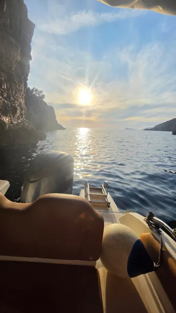 Sunset over the sea viewed from the boat
