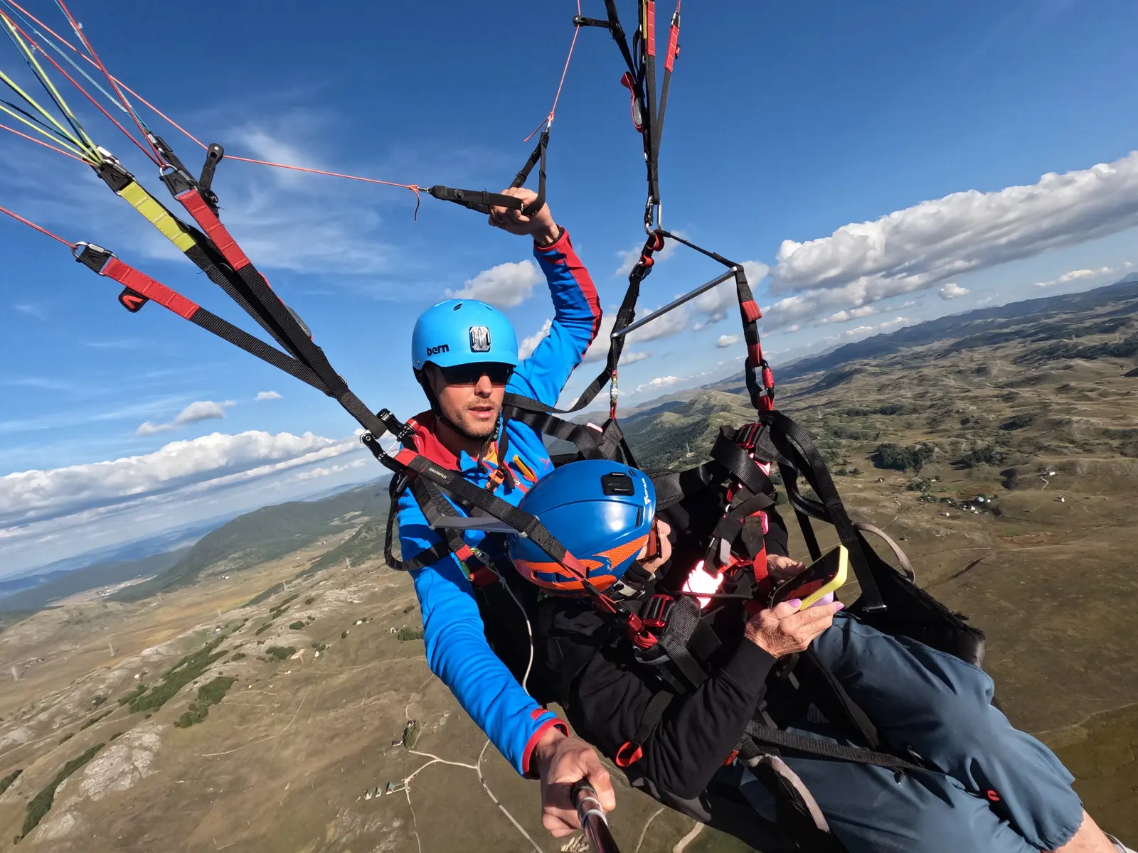 Tandem pilot and passenger flying above the Durmitor plateau