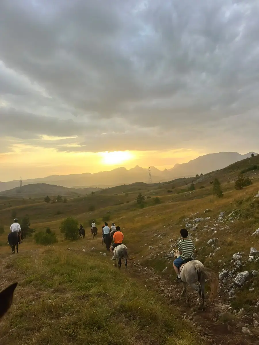 Sunset over the mountains during an evening horse ride near Žabljak