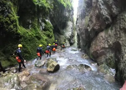 Canyoning group moving through Nevidio Canyon