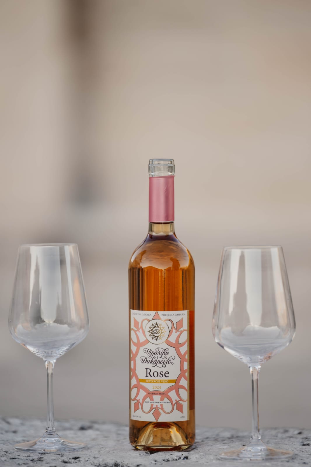 Bottle of vineyard Rosé with two wine glasses