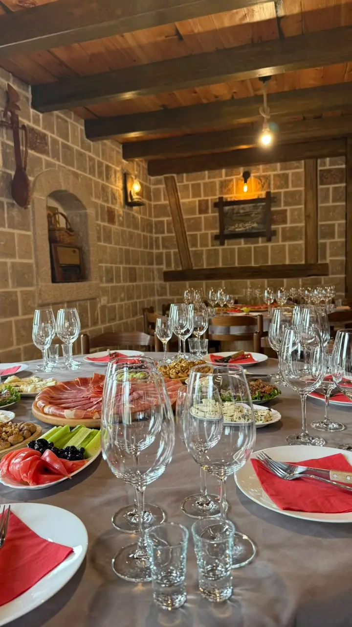 Rustic stone wine cellar prepared for guests